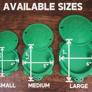 May include: Green turtle-shaped containers in three sizes: small (4" x 4.5"), medium (5" x 5.7"), and large (6" x 7"). Each container has a lid and turtle face design. The text "AVAILABLE SIZES" is at the top.