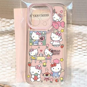 May include: A clear phone case with a pink border and a pink background featuring multiple Hello Kitty illustrations. The case has the text "SWEET BABE" at the top and "HELLO KITTY" in the center. The illustrations include Hello Kitty characters in various poses.