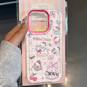 May include: Clear phone case with a pink border and Hello Kitty graphics. The case features a grid pattern and illustrations of Hello Kitty, bows, stars, and food items. The word "Love" is at the top.
