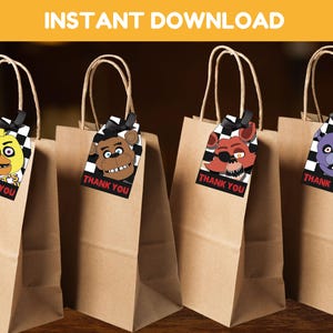 May include: Four brown paper gift bags with attached gift tags featuring characters from the Five Nights at Freddy's video game series. The tags have a black and white chequered background and say "Thank You".