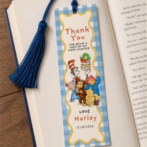 May include: A bookmark with a blue tassel, featuring a light blue gingham pattern. The design includes illustrations of classic children's book characters. Text reads "Thank You" and "Love Harley 12.08.2026".