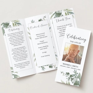 May include: A tri-fold funeral program with a green floral design. The front cover features the text "Celebrating the Life of Maxwell Smith" and a photo of the deceased. The inside pages include the order of service and an obituary.
