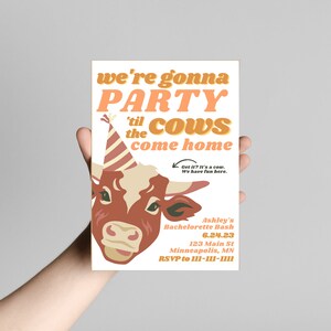 May include: A white invitation featuring a cartoon cow wearing a party hat. The text reads "we're gonna PARTY 'til the cows come home". The invitation is for Ashley's Bachelorette Bash on 6.24.23 at 123 Main St, Minneapolis, MN. RSVP to 111-111-1111.