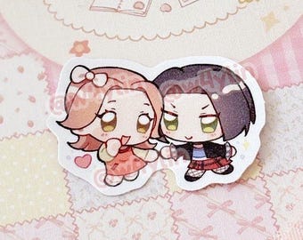 May include: A sticker featuring two anime-style characters holding hands, with a pink and white colour scheme. Above, a circular sticker with a bunny illustration and the words "my precious sticker album". The background is a patchwork pattern.