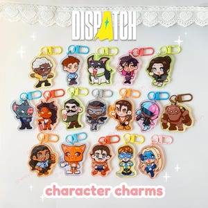 May include: Collection of character charms with various designs, each attached to a keychain clip. The charms feature colorful illustrations of cartoon characters. The word "DISPATCH" is at the top, and "character charms" is at the bottom.