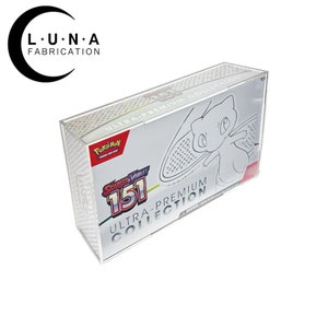 May include: A clear acrylic display case for a Pokémon Ultra-Premium Collection box. The box features the Pokémon logo, the words "Scarlet & Violet 151", and the text "Ultra-Premium Collection". A white illustration of Mew is visible on the box.