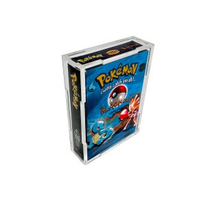 May include: A Pokémon "Blackout" theme deck in a clear plastic case. The box features a blue background with the Pokémon logo and images of Squirtle, a Poké Ball, and other characters. The text "Gotta catch 'em all!" is visible.