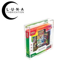May include: A clear acrylic display case containing a Pokémon trading card game set. The set includes multiple booster packs and a box with the text "First Partner Illustration Collection". The case is labeled "Series 1".