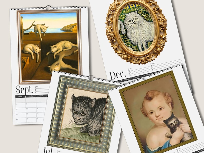 May include: A wall calendar featuring four pages with art prints of cats and a child. September shows cats in a surreal landscape, December features a white cat in an ornate gold frame, July displays a black cat, and another page shows a child holding a kitten.