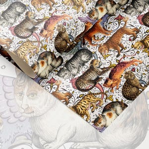 May include: A roll of patterned paper featuring a repeating design of various cat illustrations in shades of brown, orange, gray, and white. The cats are depicted in dynamic poses against a white background with floral and scroll details.