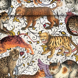 May include: A decorative pattern featuring various cat-like creatures in shades of brown, orange, and yellow, set against a white background with black and gold floral and abstract designs. The cats have detailed fur patterns and expressive faces.