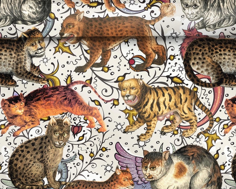 May include: A decorative pattern featuring various cat-like creatures in shades of brown, orange, and yellow, set against a white background with black and gold floral and abstract designs. The cats have detailed fur patterns and expressive faces.