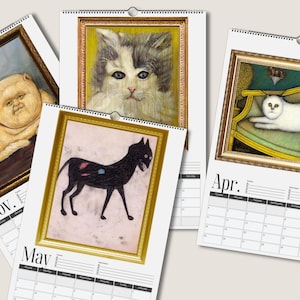 May include: A wall calendar featuring four pages with cat illustrations in gold frames. The pages show months labeled Nov., May, and Apr. with grid layouts. The cat art includes a fluffy orange cat, a grey and white cat, a black cat, and a white cat.