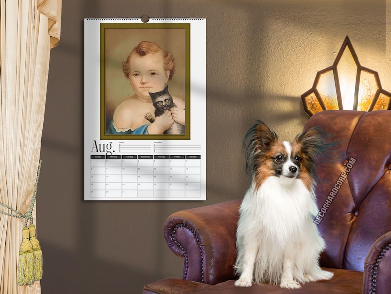 May include: A wall calendar for the month of August featuring a portrait of a child holding a small black kitten. The calendar has a white background with black text and a grid layout for the days of the month, suspended by a metal spiral binding.