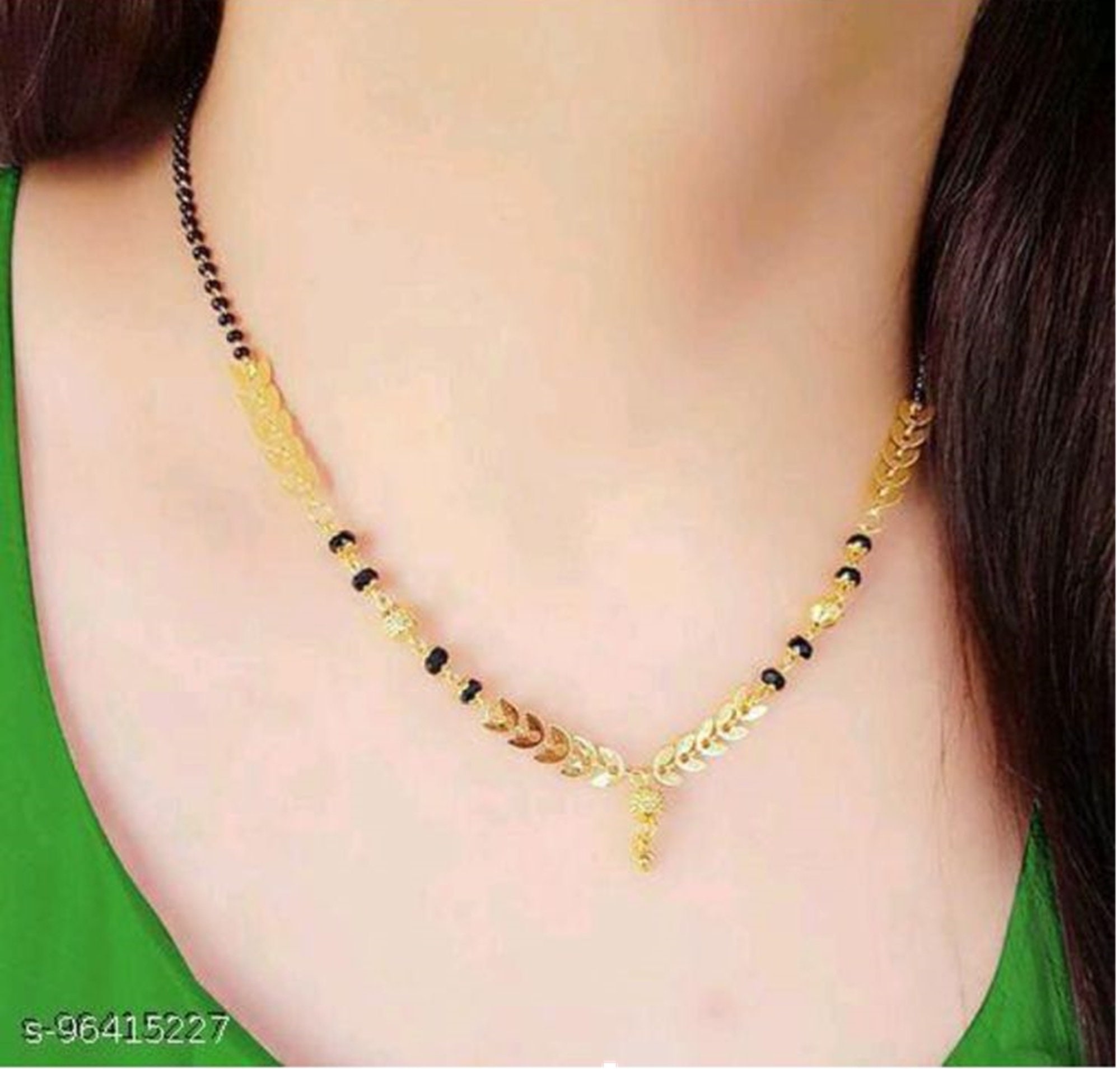 Gold mangalsutra black beads deals