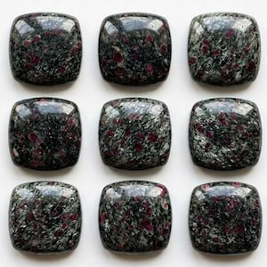 May include: Nine square cabochons with rounded corners, featuring a polished surface of dark green and black mineral matrix speckled with vibrant red inclusions, arranged in a three-by-three grid pattern on a plain white background.