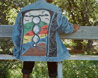 Painted denim jacket .Hand Painted "PEACE ON EARTH "  Levi's 90's Vtg  Denim Jacket, Base colors .Authentic painting .One of a kind.