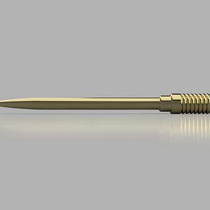 Peut inclure: Un outil en m&eacute;tal de couleur dor&eacute;e avec une longue pointe fine et un manche cylindrique textur&eacute;.