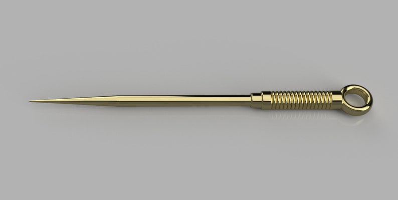Peut inclure: Un outil en m&eacute;tal dor&eacute; avec une pointe pointue et une poign&eacute;e enroul&eacute;e avec un anneau &agrave; l'extr&eacute;mit&eacute;.
