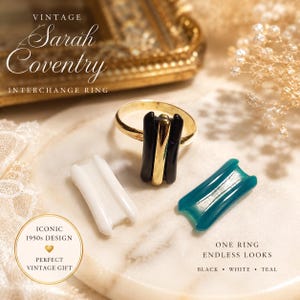 May include: Vintage Sarah Coventry Interchange Ring with interchangeable black, white, and teal inserts. The gold-tone ring features a black and gold center insert. The image includes text that reads "Iconic 1950s Design" and "One Ring Endless Looks."