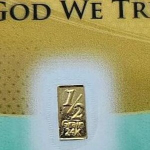 May include: A gold bar with the inscription "1/2 Gram 24K" on a white background.