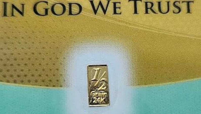 May include: A gold bar with the inscription "1/2 Gram 24K" on a white background.