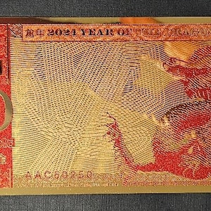 Billete de oro del Año del Dragón 2024. El Año Nuevo Lunar rinde homenaje al antiguo calendario lunar chino, la dinastía Han (206 a. C. – 9 d. C.). 2024
