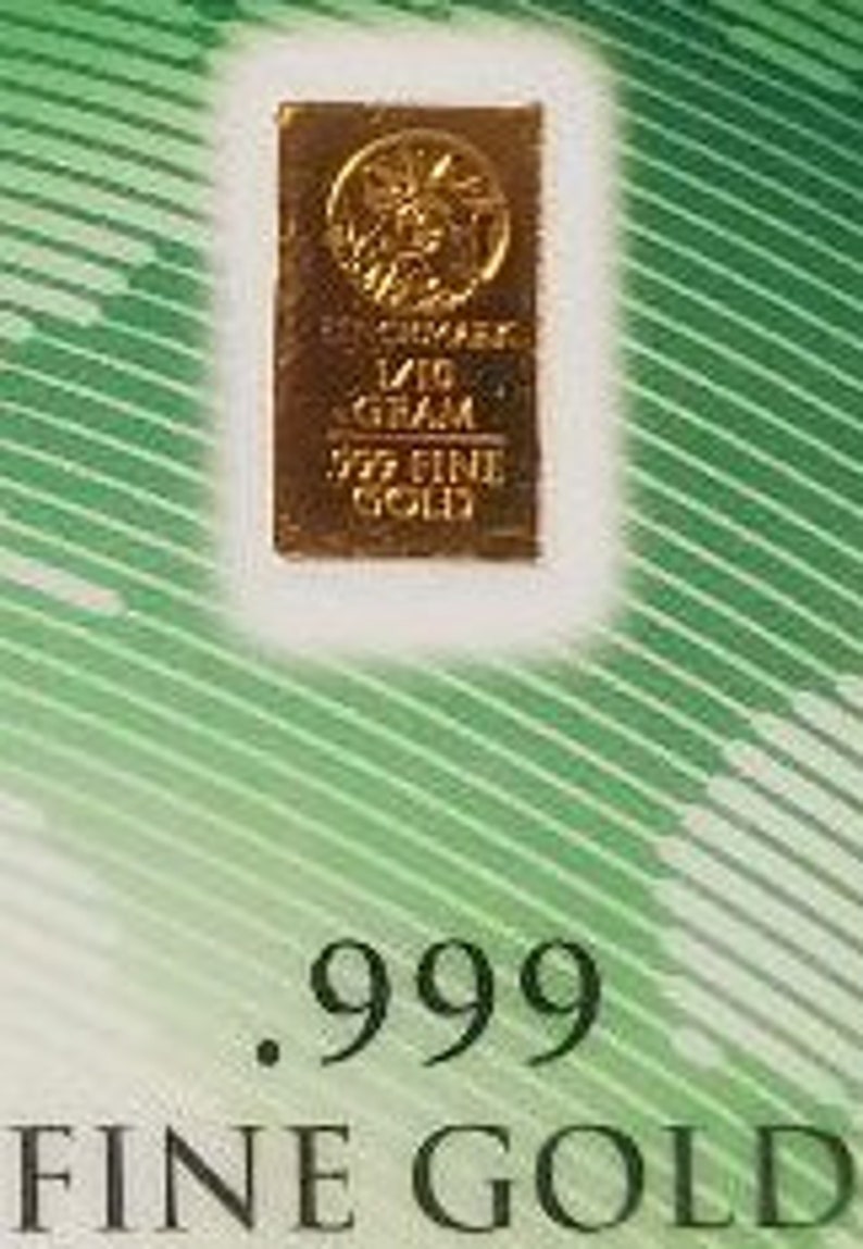 Puede incluir: Una barra de oro con la inscripci&oacute;n "1/10 OUNCE .999 FINE GOLD" y un dise&ntilde;o de &aacute;rbol estilizado.