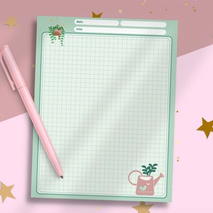 May include: A green and white gridded notepad with a hanging plant illustration at the top and a watering can illustration at the bottom. The notepad has lines for "date" and "title" at the top.