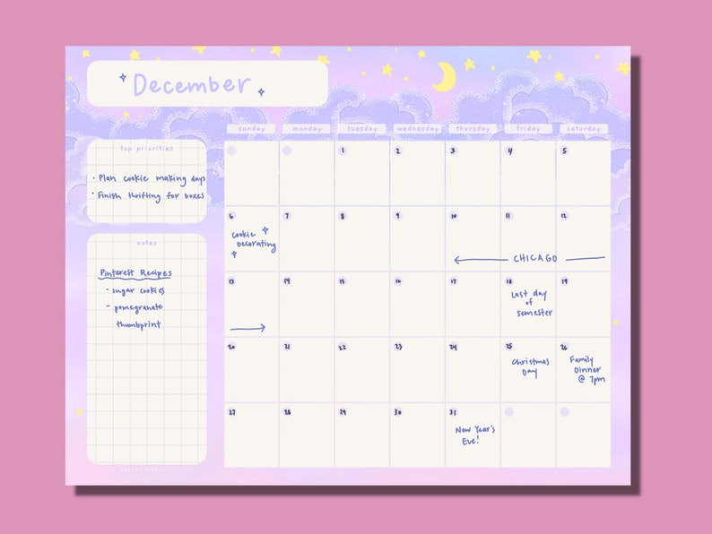 May include: A December calendar with a pastel purple and blue cloud and star design. The calendar has a list of top priorities and notes, including "Plan cookie making day" and "Pinterest Recipes". The calendar also includes dates and events, such as "Christmas Day" and "Family Dinner @ 7pm".