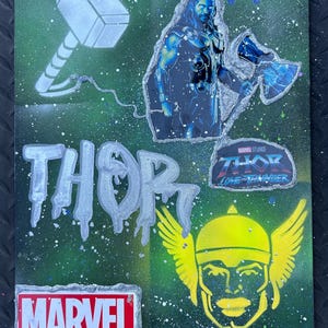 May include: A green canvas featuring a Thor theme with silver and white accents. The artwork includes the word "THOR" in large letters, a hammer, and an image of Thor. The Marvel logo and a "Thor: Love and Thunder" logo are also present.