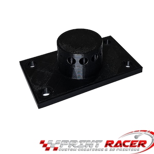 以下が含まれることがあります： 円筒形のトップと長方形のベースを持つ、黒色の3Dプリントプラスチック部品。トップには小さな穴がいくつかあります。