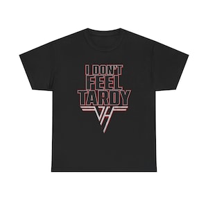 May include: Black t-shirt featuring the text "I DON'T FEEL TARDY" in red and white lettering. Below the text is a red and white striped design with a stylized "VH" logo. The shirt is made of a soft material.