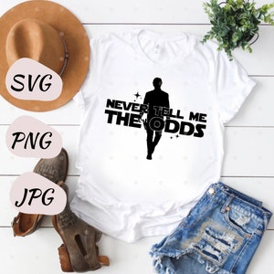 May include: White t-shirt with a black silhouette of a person walking and the text "Never Tell Me The Odds".