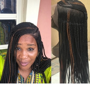 Full lace human hair based cornrow wig.
