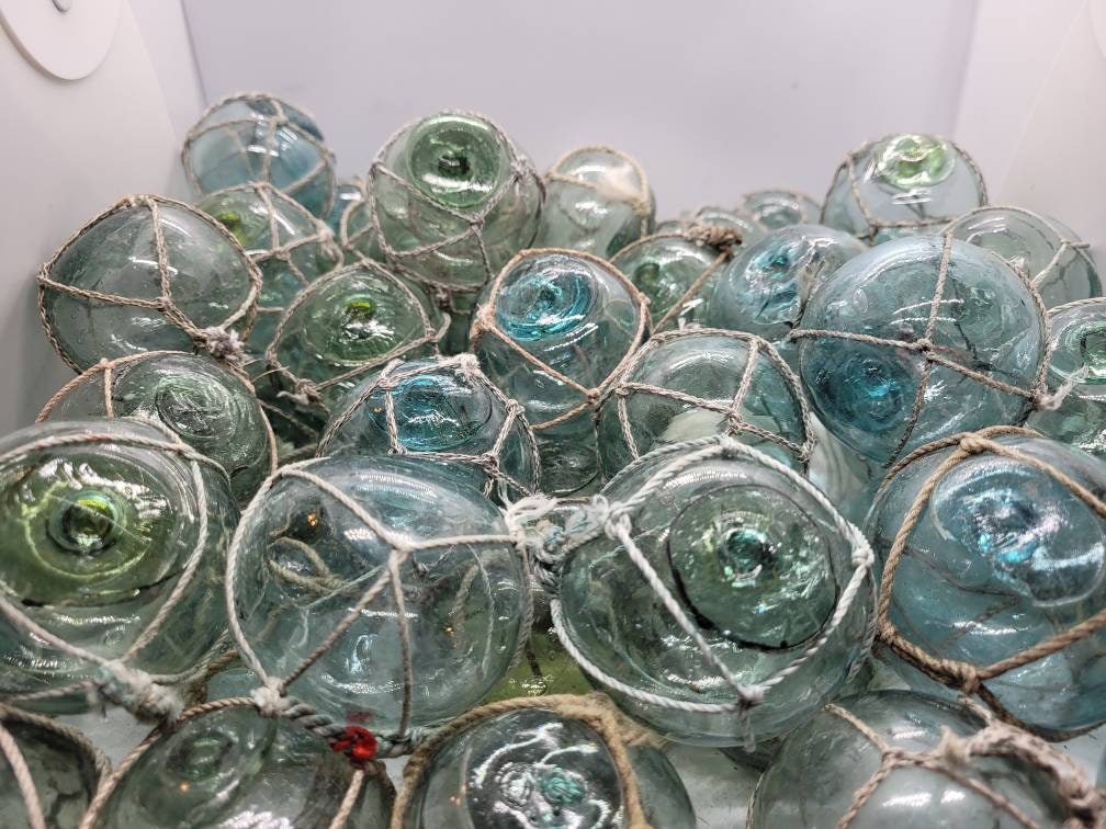 Authentic vintage Japanese glass fishing floats $30 each 4 inch diameter  Available in shades of aqua-blue and green Mix and match your f