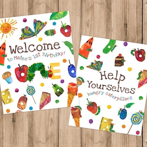 May include: Two printable signs featuring illustrations from the children's book The Very Hungry Caterpillar. The first sign says "Welcome to Mateo's 1st Birthday!" and the second sign says "Help Yourselves hungry caterpillars".