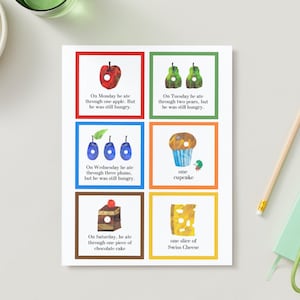 May include: A printable set of six colorful cards featuring a different food item on each card. The cards include text that reads "On Monday he ate through one apple. But he was still hungry." "On Tuesday he ate through two pears, but he was still hungry." "On Wednesday he ate through three plums, but he was still hungry." "one cupcake" "On Saturday, he ate through one piece of chocolate cake" "one slice of Swiss Cheese".