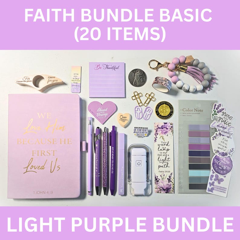 May include: A light purple Faith Bundle Basic set with 20 items, including a journal, pens, sticky notes, and decorative accessories. The journal has gold lettering that reads "We love Him because He first loved Us". The bundle is labeled "Light Purple Bundle".