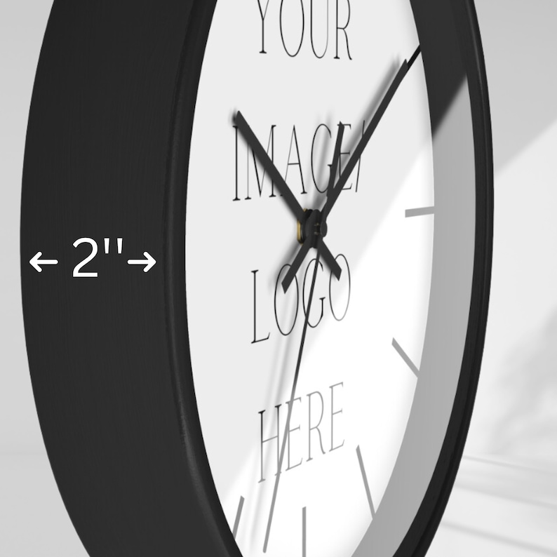 May include: A black and white clock with a 2-inch diameter. The clock face has the text "YOUR IMAGE LOGO HERE".