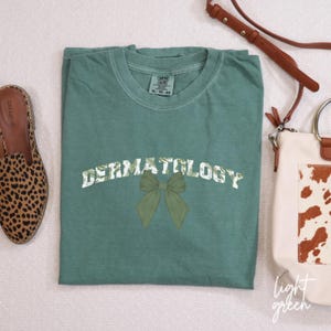 Cute Bow Dermatologist T-shirt, Dermatology Shirt, DERM Gift For Nurse, Nurse Appreciation Gift, Dermatology Tee, Derm Nurse T-Shirt, B060