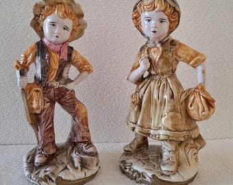 Large Italian Sculptures of a Boy and a Girl.