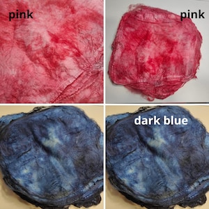 May include: Two pieces of fabric, one pink and one dark blue, are shown in a close-up. The fabric is folded and appears to be hand-dyed.