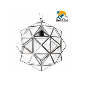 May include: A silver geometric glass pendant light fixture with a clear glass shade. The light fixture is hanging from a silver chain.