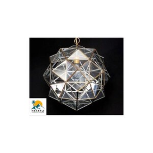 May include: A geometric glass and brass pendant light fixture with a clear glass shade. The shade is made up of many small triangles that create a unique and modern design.