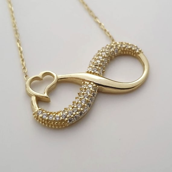 10k Yellow Gold Clear CZ Heart with Infinity Pendant 10k Yellow Gold Clear CZ Heart with Infinity Pendant