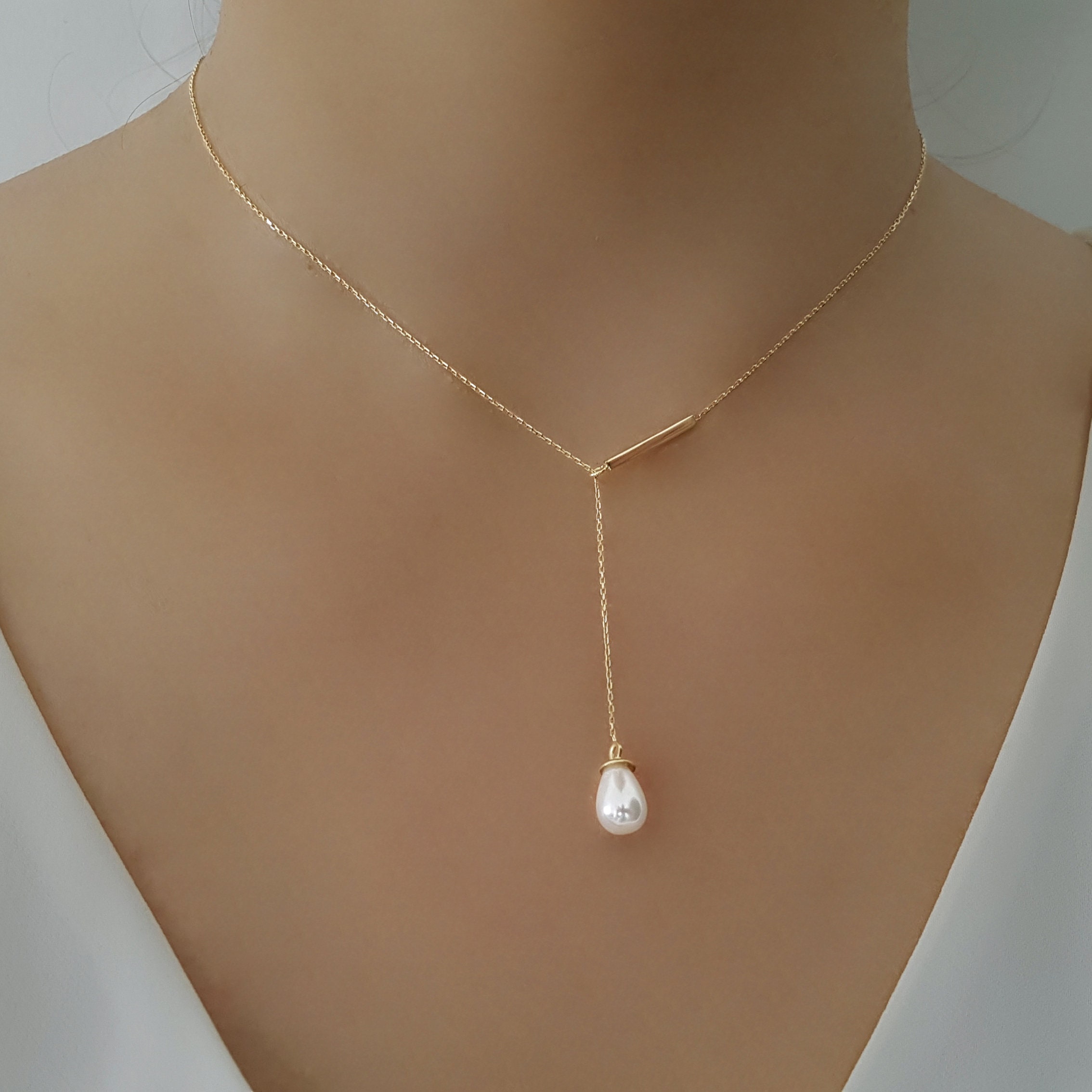 ブレスレット LESS IS MORE gold pearl drop necklace il_fullxfull.6018711354_hrcd.jpg