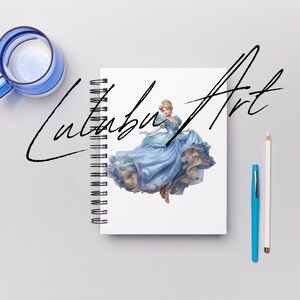 May include: A spiral-bound notebook with a princess illustration in a blue gown. The notebook is on a gray surface, with a blue glass mug, a blue pen, and a white pencil. The notebook has the text "Lutubu Art" in black script.