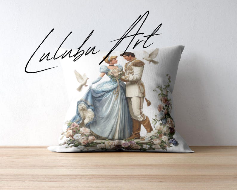 May include: A decorative pillow featuring a romantic illustration of a couple in formal attire, surrounded by flowers and doves. The couple is dressed in blue and white, with the text "Luluba Art" in a script font.