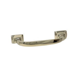 May include: A polished nickel cabinet pull with a curved shape and squared ends.